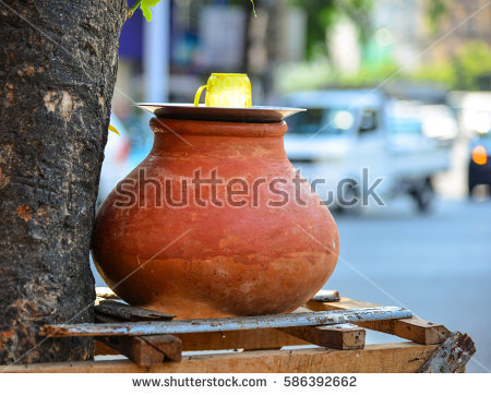 stock-photo-clay-pot-with-water-for-drinking-on-street-in-yangon-myanmar-586392662